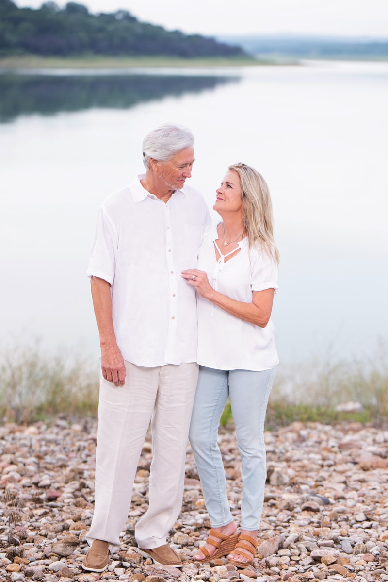 Family Photographer, Man and woman stand at lake's edge
